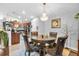 Dining room with decorative chandelier and view into the kitchen at 19343 Moorgate St, Orlando, FL 32833