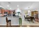 Spacious dining room featuring a chandelier, hardwood floors, and an open layout to the kitchen at 19343 Moorgate St, Orlando, FL 32833