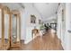 Charming foyer with hardwood floors leading to the open concept living and dining areas at 19343 Moorgate St, Orlando, FL 32833