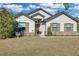 Charming single-story home with wood shutters, attractive landscaping, and a welcoming front yard at 19343 Moorgate St, Orlando, FL 32833