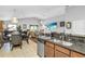 The open concept kitchen and dining area features granite countertops and stainless steel appliances at 19343 Moorgate St, Orlando, FL 32833
