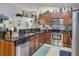 Traditional style kitchen with stainless steel appliances, dark granite counters and decor at 19343 Moorgate St, Orlando, FL 32833