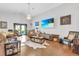 Inviting living room features hardwood floors, cozy seating, and a fireplace for gatherings at 19343 Moorgate St, Orlando, FL 32833