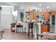 Open-concept living area with kitchen view featuring modern appliances and bar seating at 19343 Moorgate St, Orlando, FL 32833
