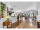 Spacious open floor plan with hardwood floors, chandeliers, and ample seating for entertaining at 19343 Moorgate St, Orlando, FL 32833