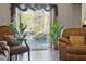Cozy seating area with a view of the screened pool with rock waterfall, enhancing the home's charm at 19343 Moorgate St, Orlando, FL 32833