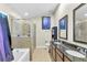 Bright primary bathroom featuring dual sinks, granite counters, and a glass-enclosed shower at 19343 Moorgate St, Orlando, FL 32833
