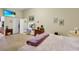 Cozy main bedroom featuring a fireplace, vanity, and access to an ensuite bathroom at 19343 Moorgate St, Orlando, FL 32833