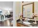 Powder room with a granite countertop, decorative soaps, and a view to the formal dining room at 19343 Moorgate St, Orlando, FL 32833