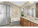 Bathroom featuring a double sink vanity, garden tub, and glass-enclosed shower at 200 Gala Cir, Daytona Beach, FL 32124