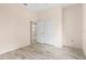 A bright bedroom with a neutral palette, wood-look flooring and double door closet at 200 Gala Cir, Daytona Beach, FL 32124