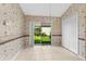 Dining room featuring tiled flooring, closet, chandelier, and sliding glass doors to backyard at 200 Gala Cir, Daytona Beach, FL 32124