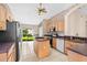 Functional kitchen featuring an island, appliances, and direct access to the backyard at 200 Gala Cir, Daytona Beach, FL 32124