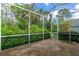 Spacious screened lanai offers serene views of lush greenery and tropical foliage at 200 Gala Cir, Daytona Beach, FL 32124