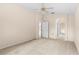 Spacious primary bedroom featuring neutral carpet, ceiling fan, and ensuite bath at 200 Gala Cir, Daytona Beach, FL 32124