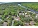 Beautiful aerial view of a neighborhood nestled along a scenic river at 2004 Quail Hollow Dr, Deland, FL 32720