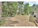 Expansive backyard with lush greenery and mature trees, offering a private and tranquil outdoor retreat at 2004 Quail Hollow Dr, Deland, FL 32720