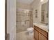 Bathroom featuring walk-in shower with glass door, toilet, and granite vanity at 2004 Quail Hollow Dr, Deland, FL 32720