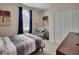 Comfortable bedroom with a plush armchair, serene decor, and a bright window with elegant curtains at 2004 Quail Hollow Dr, Deland, FL 32720