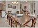 Elegant dining room featuring a large table, seating for eight, and neutral decor at 2004 Quail Hollow Dr, Deland, FL 32720
