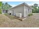 Home exterior featuring a generator and access to a screened in patio at 2004 Quail Hollow Dr, Deland, FL 32720