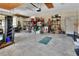 Organized garage featuring ample storage space, workbench, and convenient access to the home at 2004 Quail Hollow Dr, Deland, FL 32720