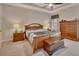 Comfortable bedroom with a ceiling fan, and a chest at the foot of the bed at 2004 Quail Hollow Dr, Deland, FL 32720