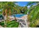 Community pool featuring palms and lounge chairs at 2004 Quail Hollow Dr, Deland, FL 32720
