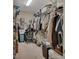 Organized walk-in closet featuring ample storage with shelves and hanging rods for clothes and personal items at 2004 Quail Hollow Dr, Deland, FL 32720