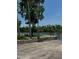 Community boat launch area with picnic table and bench overlooking the water at 2004 Quail Hollow Dr, Deland, FL 32720
