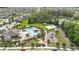 Aerial view of a community featuring a pool, playground, and green spaces at 211 Duke Dr, Deland, FL 32724