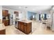 Open concept kitchen features a center island with barstool seating and opens to the living room at 211 Duke Dr, Deland, FL 32724