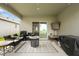 Inviting covered patio perfect for outdoor dining and relaxation, complete with a grill at 211 Duke Dr, Deland, FL 32724