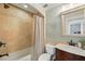 Cozy bathroom featuring a tub with tile surround and a vanity with a vessel sink at 226 Treeline Ln, Ormond Beach, FL 32174