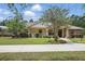 Attractive single-story home with inviting porch, well-kept lawn, and established trees at 226 Treeline Ln, Ormond Beach, FL 32174