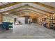 A bright and spacious detached garage with an open layout, shelving, and room for multiple vehicles at 226 Treeline Ln, Ormond Beach, FL 32174