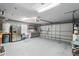 Spacious garage featuring stainless refrigerator, workbench, and ample storage for tools and equipment at 226 Treeline Ln, Ormond Beach, FL 32174