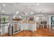 Open kitchen with granite counters, stainless appliances, and seamless flow to living spaces at 226 Treeline Ln, Ormond Beach, FL 32174
