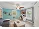 Stylish living room featuring modern decor, a media center, light blue walls, and natural light at 226 Treeline Ln, Ormond Beach, FL 32174