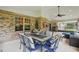 Covered patio features a dining set, outdoor seating, and a barbecue grill at 226 Treeline Ln, Ormond Beach, FL 32174
