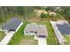 Aerial view of a home featuring an attached garage and a well-manicured lawn at 2379 8Th Ave, Deland, FL 32724