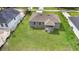 An aerial view of a well-maintained home featuring a spacious yard and gray exterior at 2379 8Th Ave, Deland, FL 32724