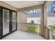 View from covered back patio with black framed doors and grassy backyard at 2379 8Th Ave, Deland, FL 32724