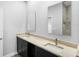 Bathroom featuring a marble countertop, dark cabinetry, and a large mirror at 2379 8Th Ave, Deland, FL 32724