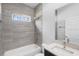 Tiled bathroom with a combined shower and tub and sleek countertops at 2379 8Th Ave, Deland, FL 32724