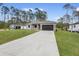 Charming one-story home with well-kept lawn and a paved driveway at 2379 8Th Ave, Deland, FL 32724