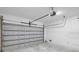 Clean garage featuring a white door and ceiling-mounted door opener at 2379 8Th Ave, Deland, FL 32724