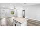 Bright living room with kitchen island, modern finishes, and lots of natural light at 2379 8Th Ave, Deland, FL 32724