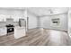Bright living room and kitchen area with stainless steel appliances and modern finishes at 2379 8Th Ave, Deland, FL 32724