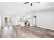 Open-concept living space with kitchen, stainless steel appliances, and outdoor patio access at 2379 8Th Ave, Deland, FL 32724